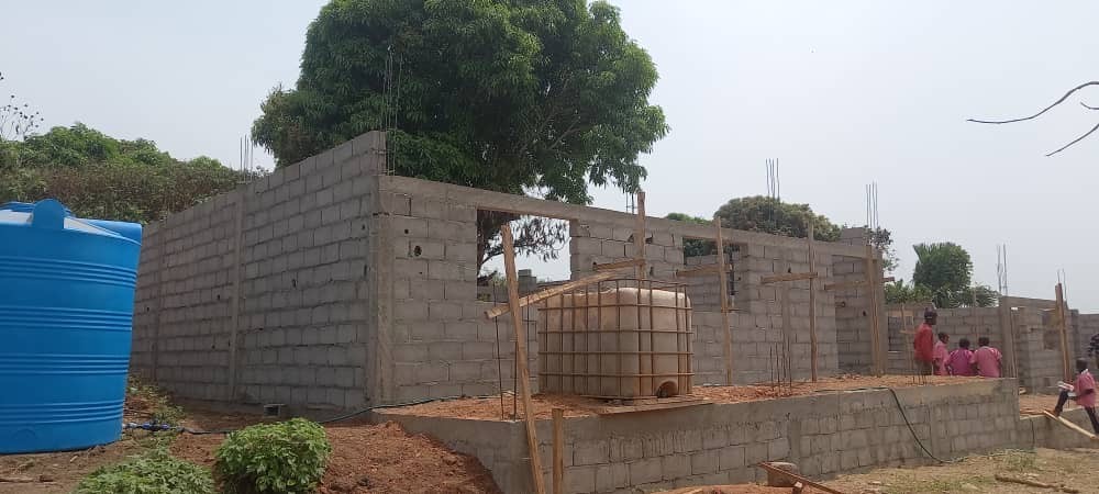 Altitude Water Africa clean water infrastructure project under construction with storage tanks, supporting sustainable atmospheric water programs for local communities.