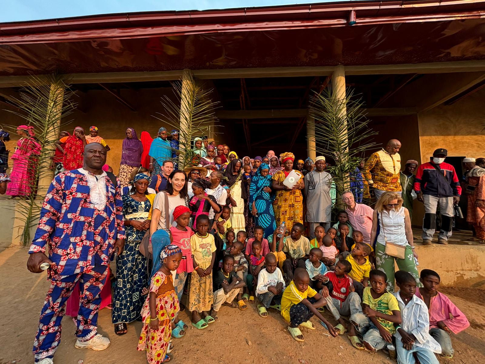 Community gathering in a rural village illustrating The Global Water Crisis and the Rise of AWG Technology as a sustainable solution for clean drinking water access.