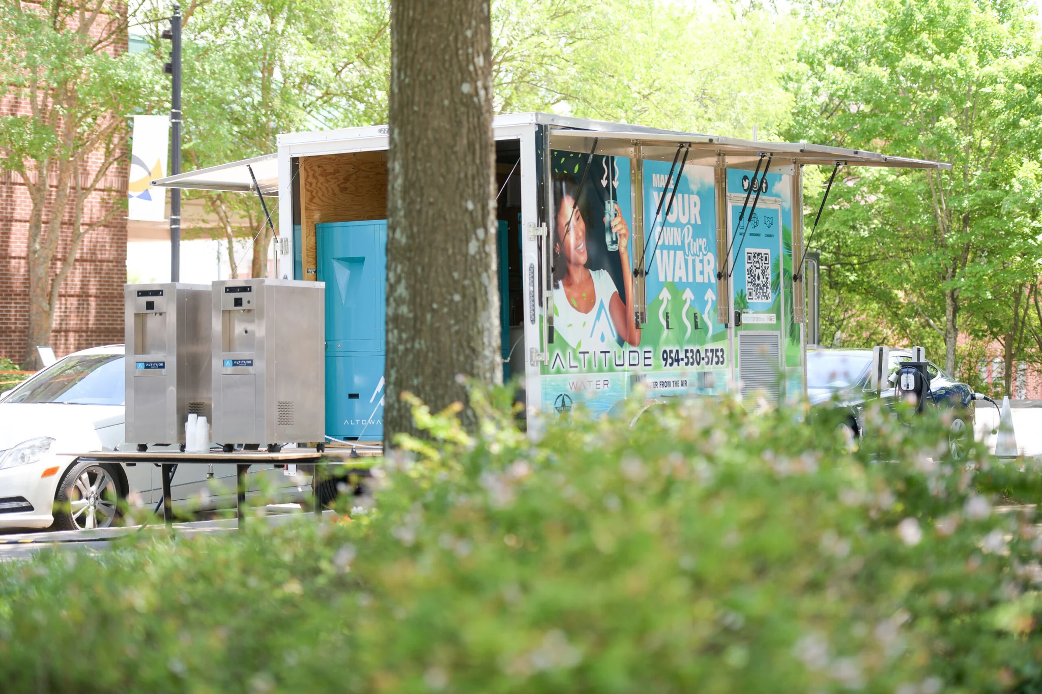 Altitude Water mobile atmospheric water system trailer delivering clean drinking water at community event